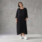 Schwarzes Ballonkleid aus Jersey mit Stretch Rundhalsausschnitt und Seitennahttaschen