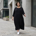 Schwarzes Ballonkleid aus Jersey mit Stretch Rundhalsausschnitt und Seitennahttaschen