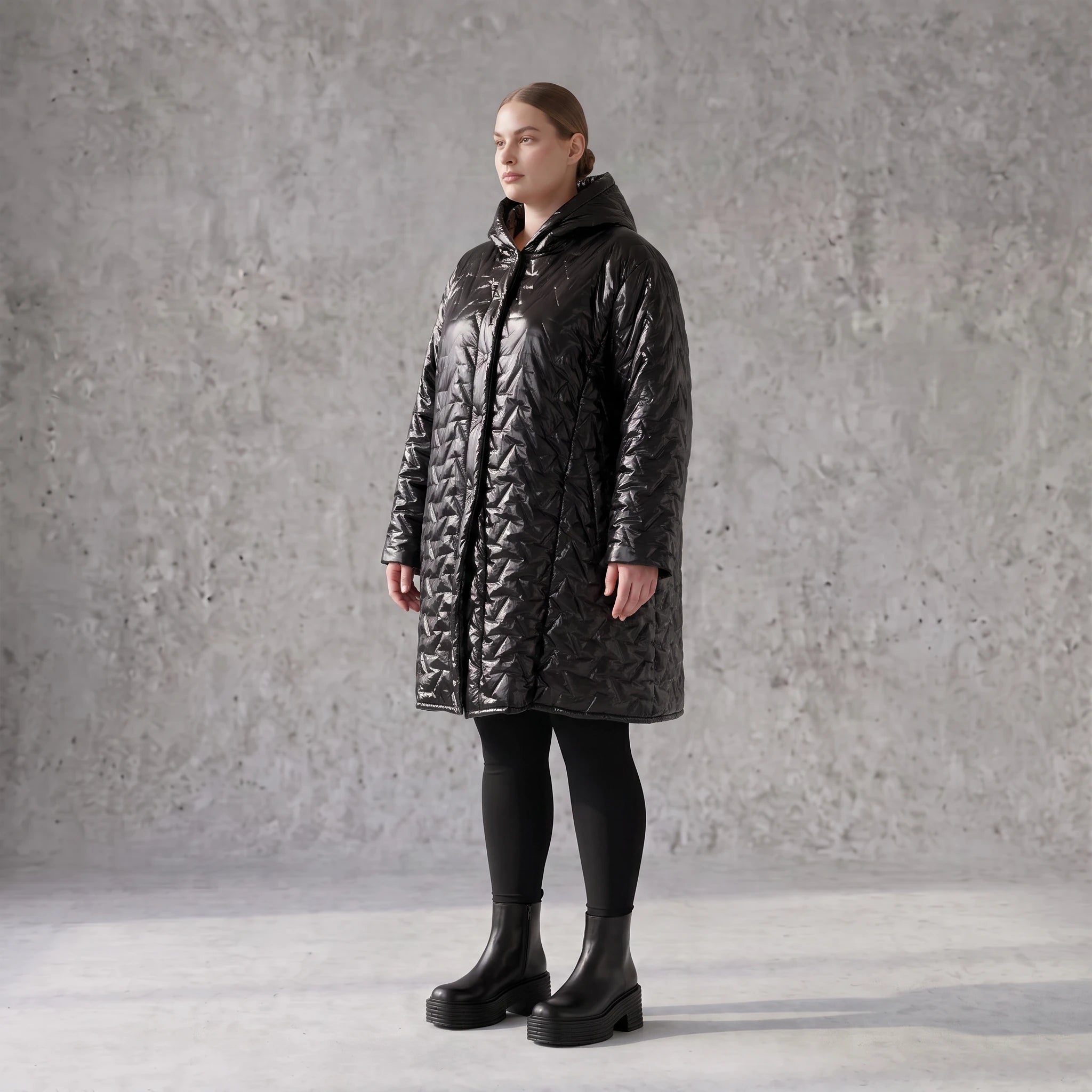 Schwarze Steppjacke mit Kapuze im Ballonschnitt oversized mit Grafikmuster und Taschen