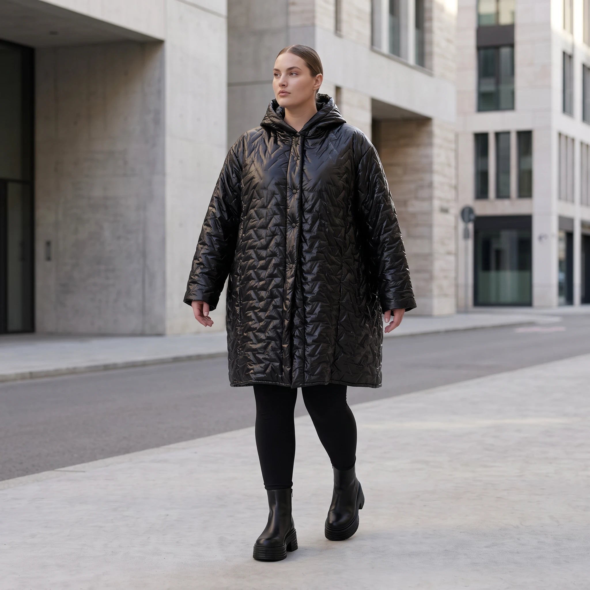 Schwarze Steppjacke mit Kapuze im Ballonschnitt oversized mit Grafikmuster und Taschen