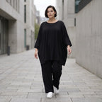Schwarzes lässiges Glockenshirt aus Jersey mit Rundhalsausschnitt und Seitentaschen