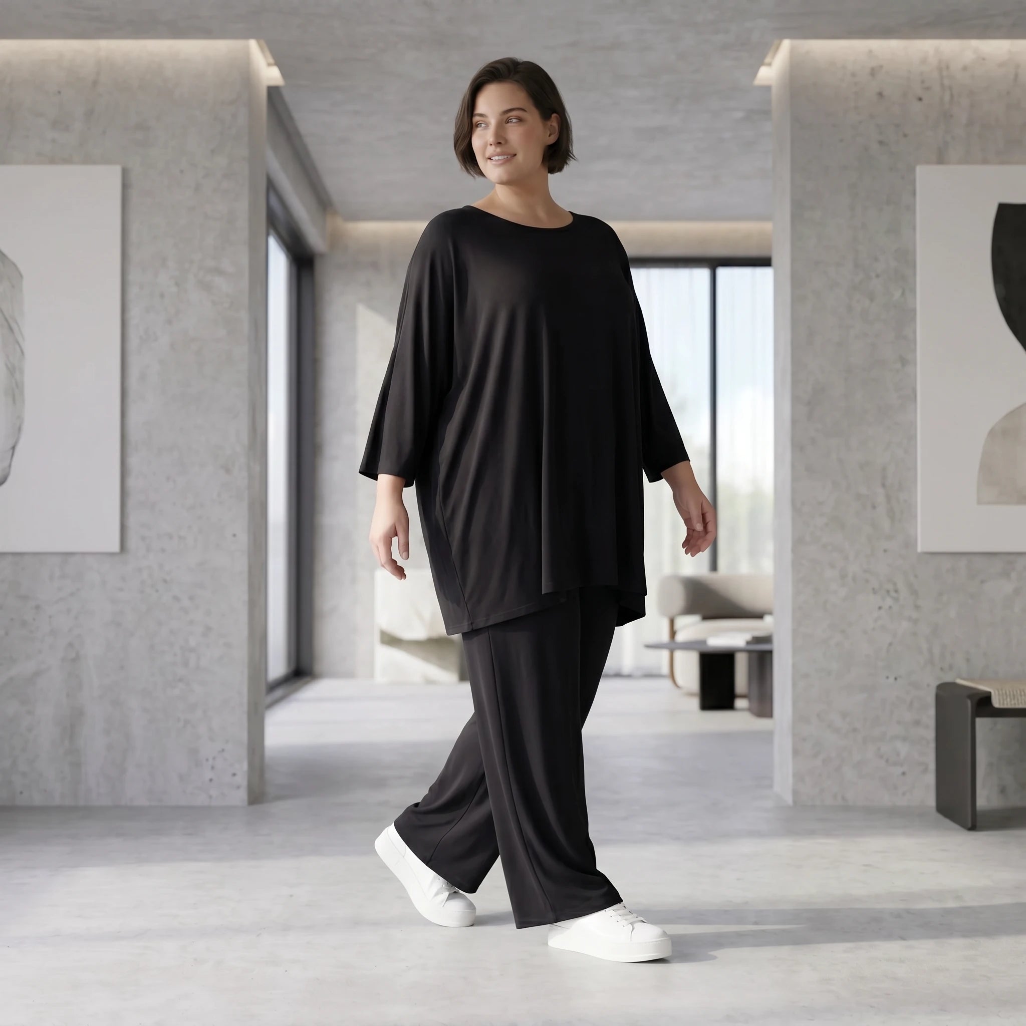 Schwarzes lässiges Glockenshirt aus Jersey mit Rundhalsausschnitt und Seitentaschen