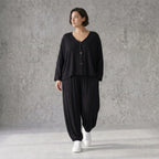 Schwarze Ballonhose aus Stretchjersey mit Seitentaschen und Raffdetail am Hosenbein