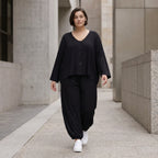 Schwarze Ballonhose aus Stretchjersey mit Seitentaschen und Raffdetail am Hosenbein