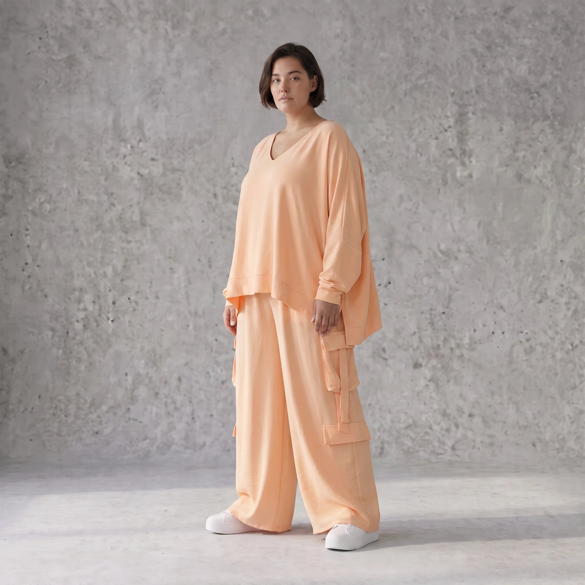 Legere Oversize Ballonhose in fliessendem Mauve mit Lagenlook und Fransen Details Trend