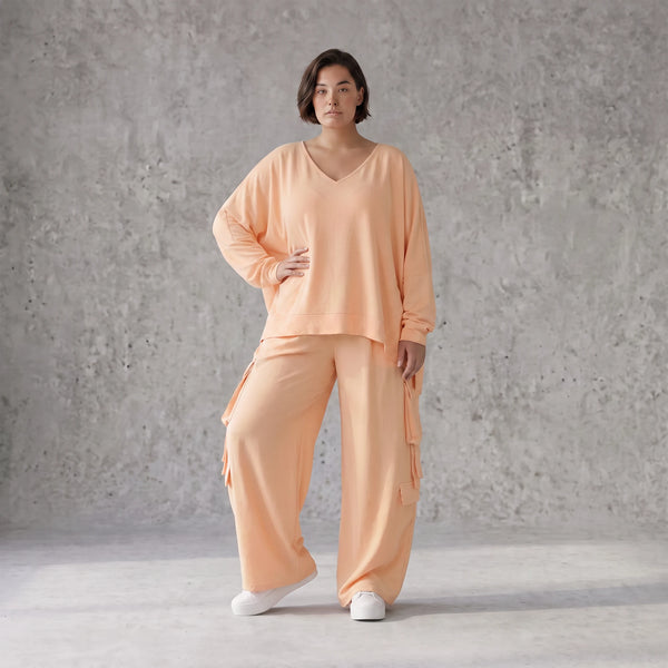 Legere Oversize Ballonhose in fliessendem Mauve mit Lagenlook und Fransen Details Trend