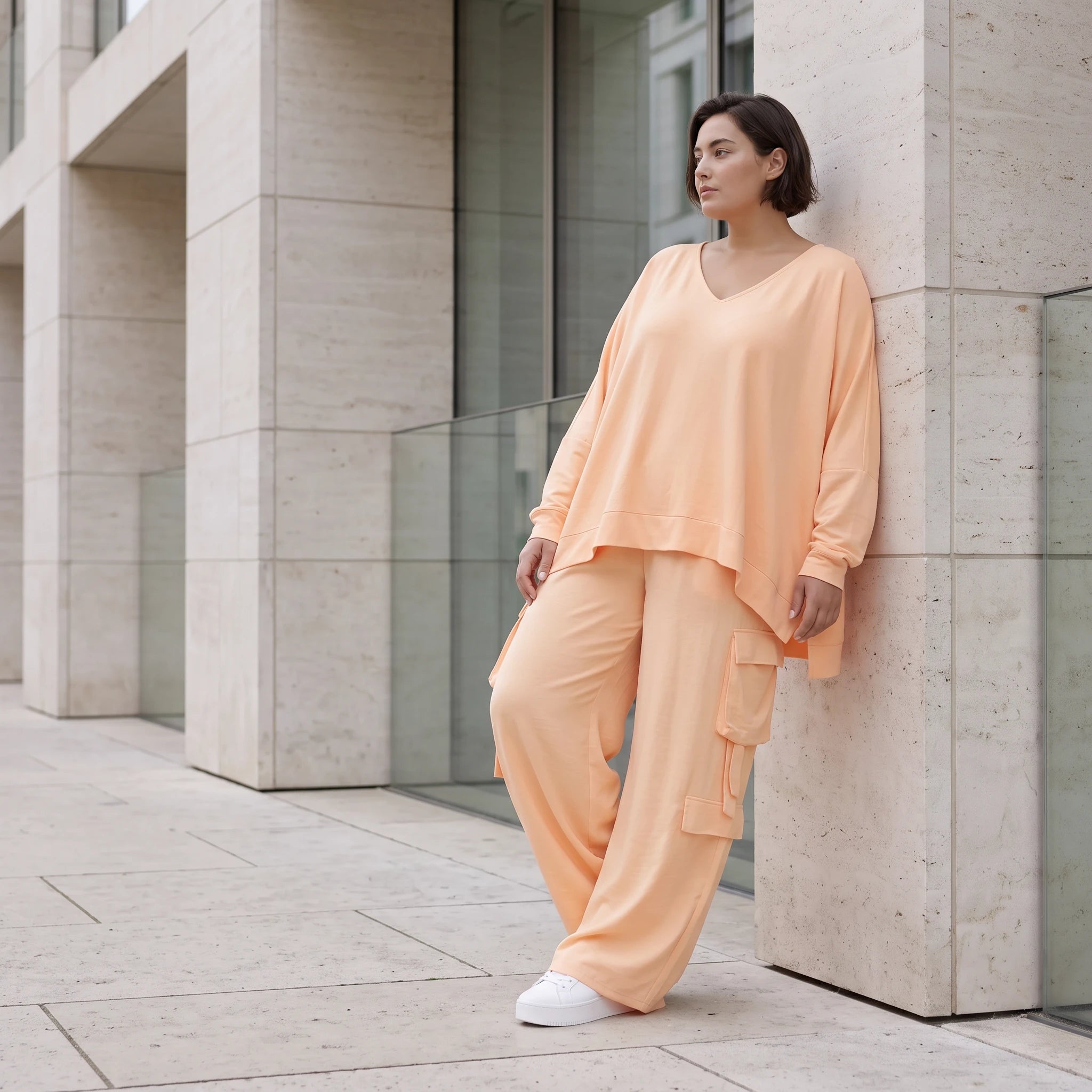 Legere Oversize Ballonhose in fliessendem Mauve mit Lagenlook und Fransen Details Trend
