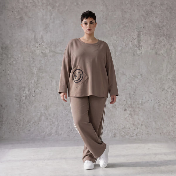 Sweatshirt aus French Terry mit Smileyprint und asymmetrischer Tasche in gerundeter Form