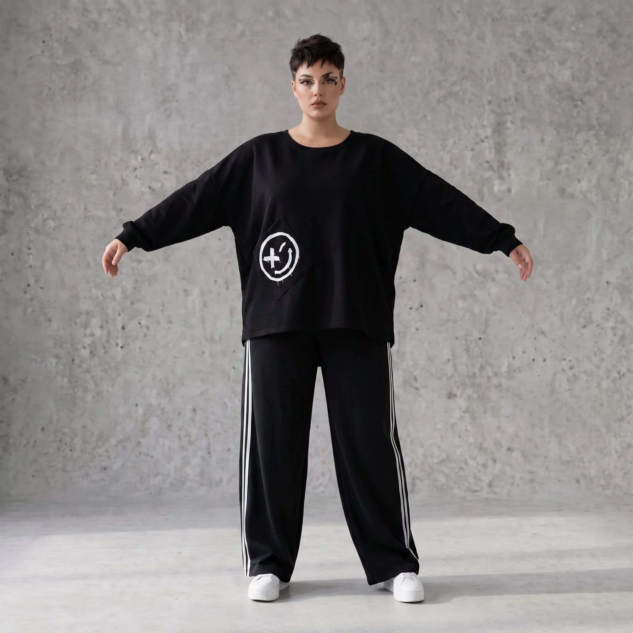 Sweatshirt mit Smileyprint und asymmetrischer Tasche aus weichem French Terry Rundhals