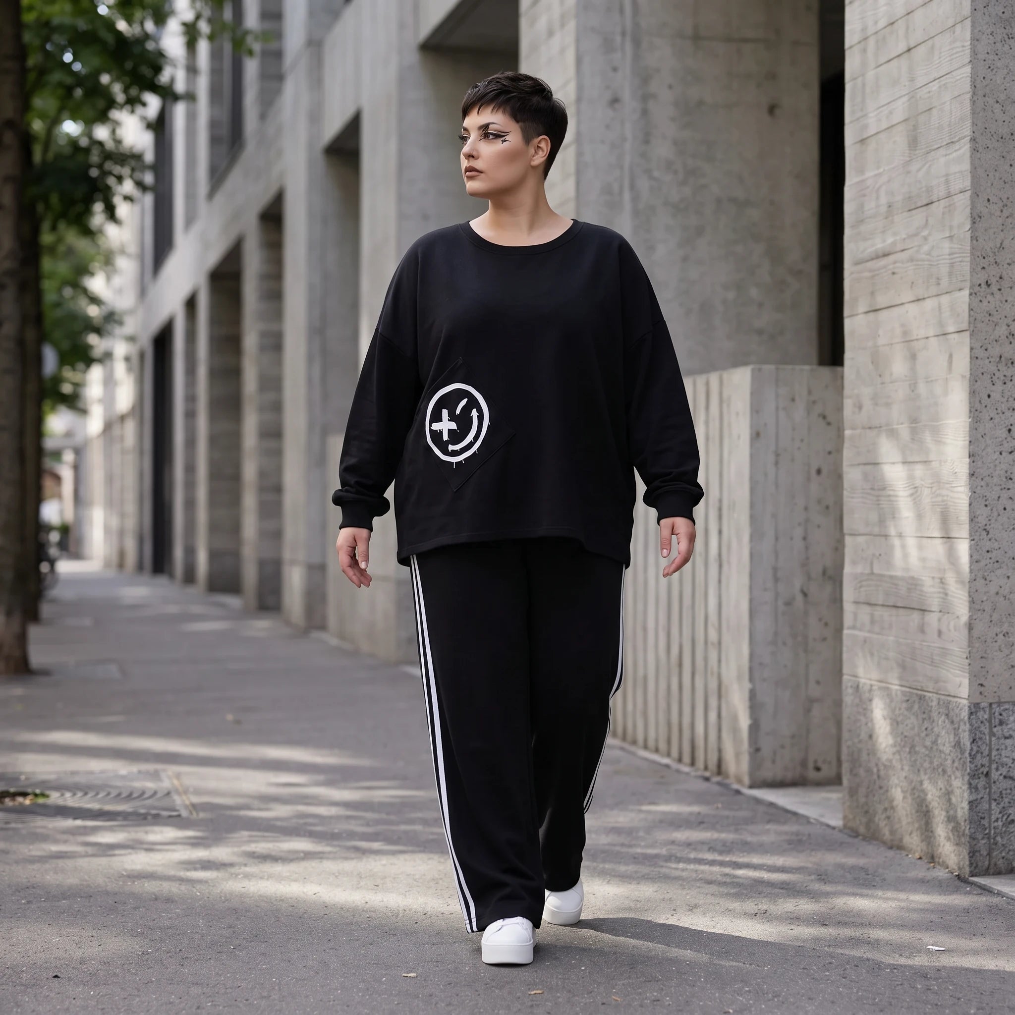 Sweatshirt mit Smileyprint und asymmetrischer Tasche aus weichem French Terry Rundhals