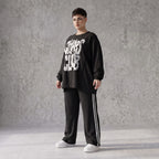 Statementshirt aus French Terry mit Chaos Club Print kastig und vorne kürzer geschnitten