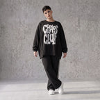 Statementshirt aus French Terry mit Chaos Club Print kastig und vorne kürzer geschnitten