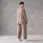 Taupe Ballonhose aus weichem French Terry mit Smileymuster Biesennähten und Dehnbund