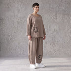 Taupe Ballonhose aus weichem French Terry mit Smileymuster Biesennähten und Dehnbund