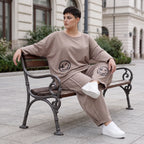 Taupe Ballonhose aus weichem French Terry mit Smileymuster Biesennähten und Dehnbund