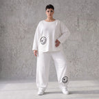 Oversizehose aus warmem French Terry mit Smileyprint gesmoktem Saum und Seitentaschen
