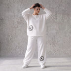 Oversizehose aus warmem French Terry mit Smileyprint gesmoktem Saum und Seitentaschen
