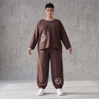 Lässige Oversizedhose aus French Terry mit Smileyprint und gesmoktem Saum extra lang