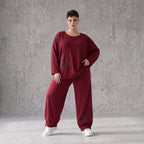 Oversized French Terry Hose in Schwarz mit Smileyprint gesmoktem Saum und weitem Bein