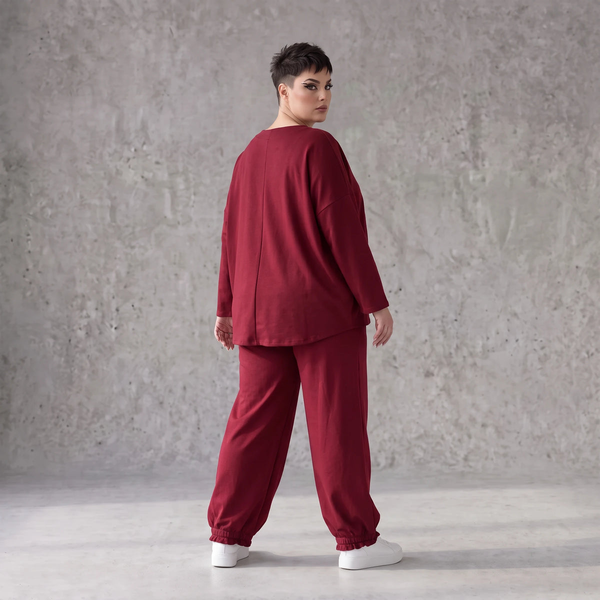Oversized French Terry Hose in Schwarz mit Smileyprint gesmoktem Saum und weitem Bein