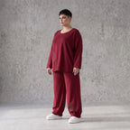 Oversized French Terry Hose in Schwarz mit Smileyprint gesmoktem Saum und weitem Bein