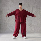 Oversized French Terry Hose in Schwarz mit Smileyprint gesmoktem Saum und weitem Bein