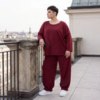 Oversized French Terry Hose in Schwarz mit Smileyprint gesmoktem Saum und weitem Bein
