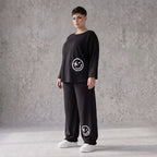 Oversized Hose aus flauschigem French Terry mit Smileydruck und bequem gesmoktem Saum