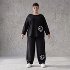 Oversized Hose aus flauschigem French Terry mit Smileydruck und bequem gesmoktem Saum