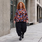 Langarmshirt aus Romanit Jersey in Schwarz/Orange mit Glockenschnitt pflegeleicht weich