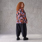 Langarmshirt aus Romanit Jersey in Schwarz/Orange mit Glockenschnitt pflegeleicht weich