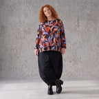 Langarmshirt aus Romanit Jersey in Schwarz/Orange mit Glockenschnitt pflegeleicht weich