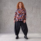 Langarmshirt aus Romanit Jersey in Schwarz/Orange mit Glockenschnitt pflegeleicht weich
