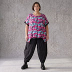 Asymmetrische Vokuhilaweste aus Jersey und Netzstoff im Materialmix vorne kurz hinten lang