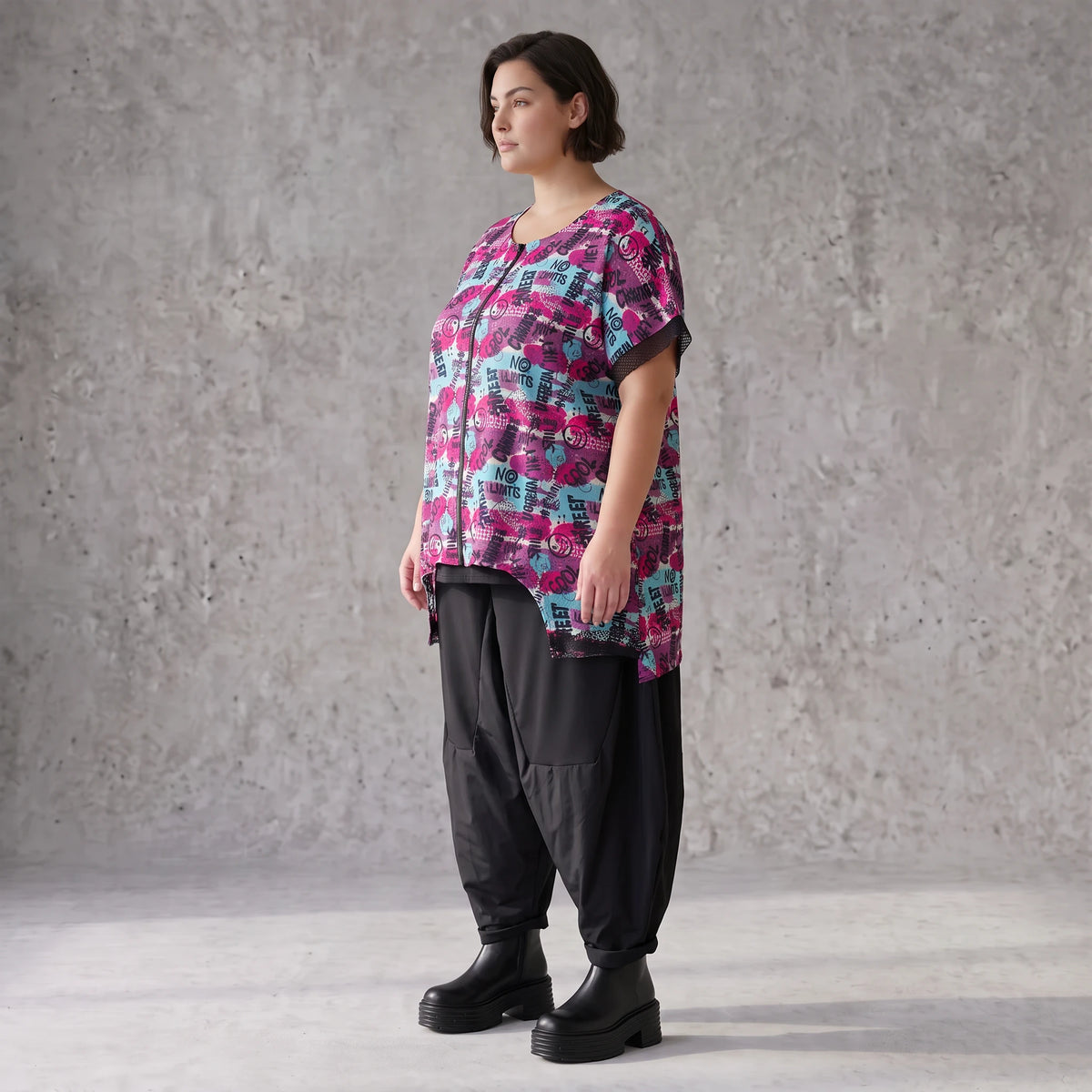 Asymmetrische Vokuhilaweste aus Jersey und Netzstoff im Materialmix vorne kurz hinten lang