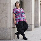 Asymmetrische Vokuhilaweste aus Jersey und Netzstoff im Materialmix vorne kurz hinten lang