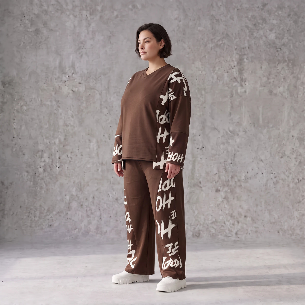 Braune Fleece Ballonhose mit Stretch Schnürbund und Taschen für winterlichen Komfort