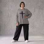 A-Linie Langarmshirt aus feinem Stretchjersey in Schwarz/Weiß mit seitlichen Schlitzen