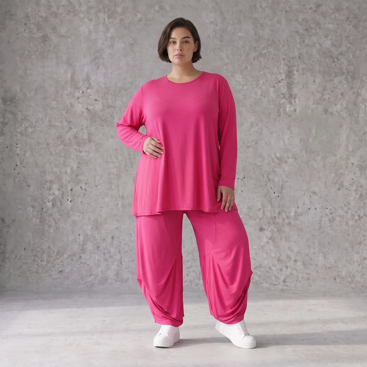 Pinkes Langarmshirt in Glockenform aus softer Slinkyqualität mit Rundhalsausschnitt