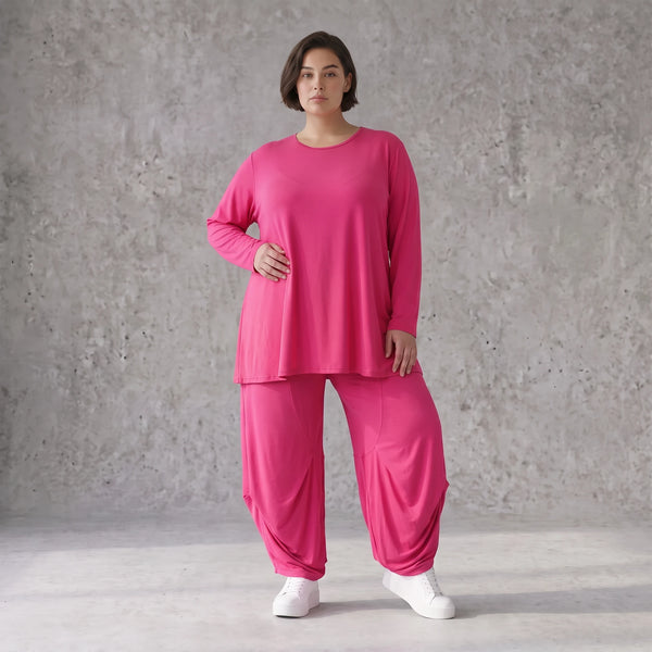 Pinkes Langarmshirt in Glockenform aus softer Slinkyqualität mit Rundhalsausschnitt