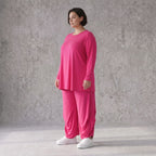 Pinkes Langarmshirt in Glockenform aus softer Slinkyqualität mit Rundhalsausschnitt
