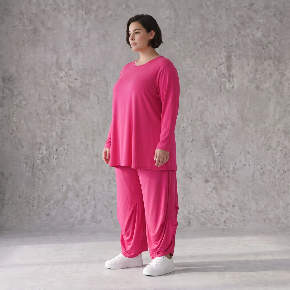 Pinkes Langarmshirt in Glockenform aus softer Slinkyqualität mit Rundhalsausschnitt