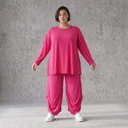 Pinkes Langarmshirt in Glockenform aus softer Slinkyqualität mit Rundhalsausschnitt