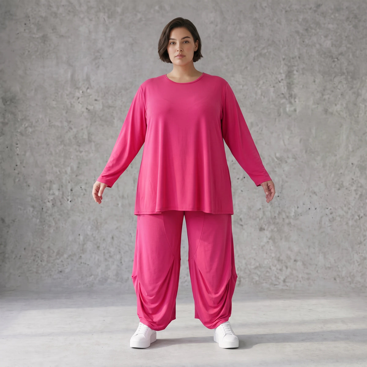 Pinkes Langarmshirt in Glockenform aus softer Slinkyqualität mit Rundhalsausschnitt