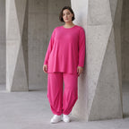 Pinkes Langarmshirt in Glockenform aus softer Slinkyqualität mit Rundhalsausschnitt