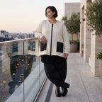 Cremefarbene Strickjacke in A-Form mit Reißverschluss Taschen und weichem Stretchstrick