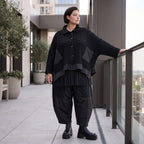 Schwarze Strickjacke in A-Linie aus Baumwolle Acryl mit Knopfleiste und Zipfelsaum