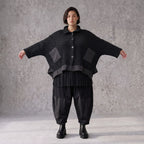 Schwarze Strickjacke in A-Linie aus Baumwolle Acryl mit Knopfleiste und Zipfelsaum
