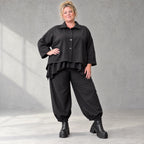 Schwarze Denimballonhose mit Stretch und bequemem Schlupfbund in weiter Passform