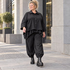 Schwarze Denimballonhose mit Stretch und bequemem Schlupfbund in weiter Passform